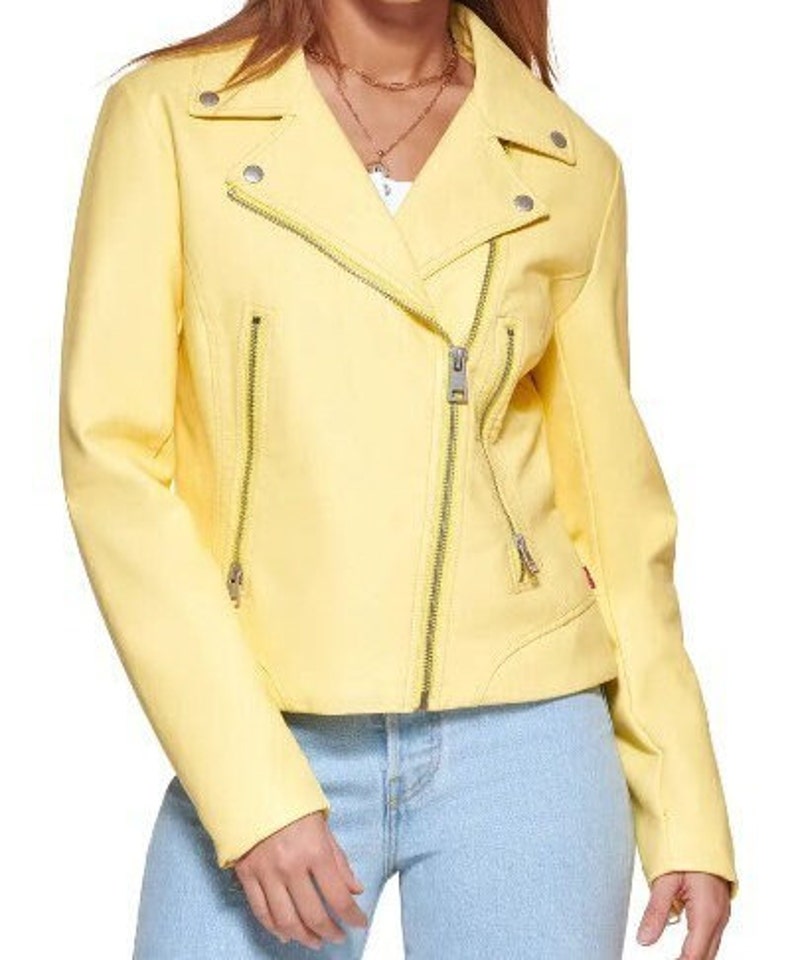 May include: A yellow leather motorcycle jacket with a zipper closure. The jacket has a stand-up collar and two pockets on the front.