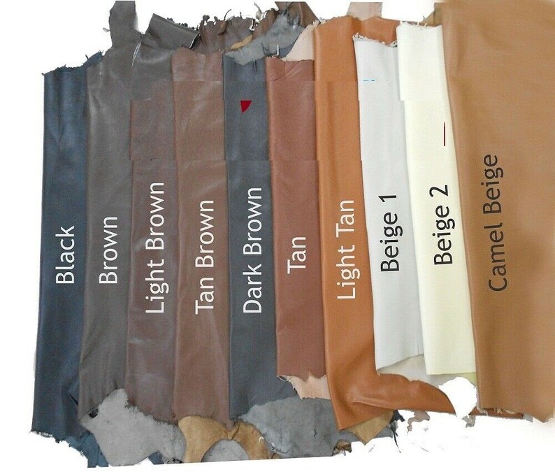 May include: A selection of leather swatches in various shades of brown, beige, and black. The swatches are labeled with their respective colors: Black, Brown, Light Brown, Tan Brown, Dark Brown, Tan, Light Tan, Beige 1, Beige 2, and Camel Beige.