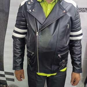 May include: A black leather motorcycle jacket with white stripes on the sleeves and collar. The jacket has a zipper closure and multiple pockets.