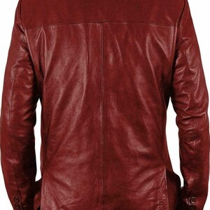 May include: A burgundy leather jacket with a button-up front and long sleeves.