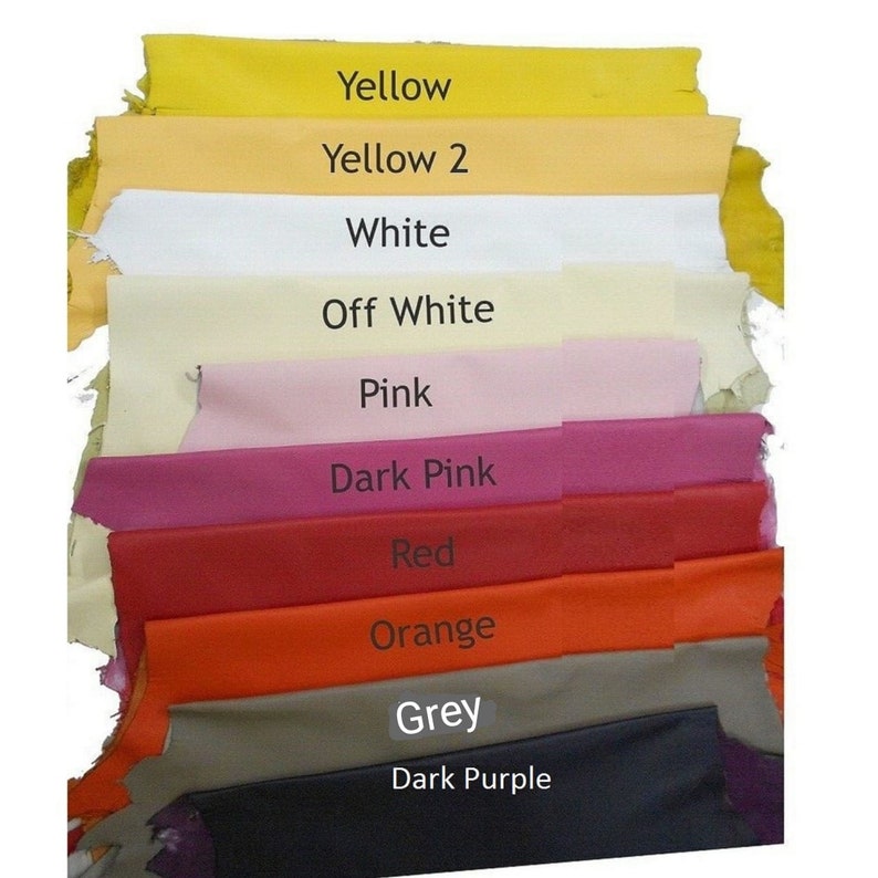 May include: A stack of fabric swatches in various colors, including yellow, white, pink, red, orange, grey, and dark purple. The swatches are labeled with their corresponding colors.
