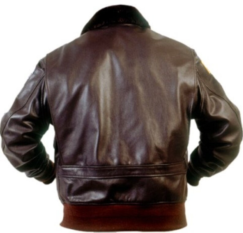 May include: A brown leather bomber jacket with a fur collar and a ribbed knit bottom band.