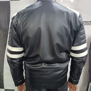 May include: Black leather jacket with white stripes on the sleeves.