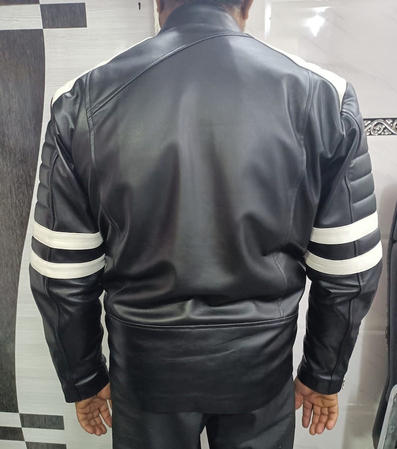 May include: Black leather jacket with white stripes on the sleeves.