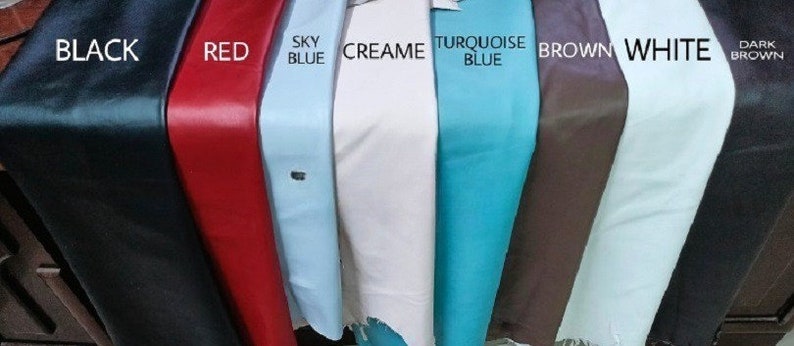 May include: A selection of leather swatches in various colors, including black, red, sky blue, cream, turquoise blue, brown, white, and dark brown.