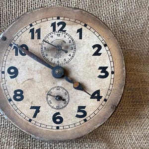 Antique Junghans alarm clock mechanism, patinated dial and mechanical movement, a timepiece in need of restoration