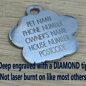 May include: Silver paw-shaped pet ID tag with engraved text: "PET NAME", "PHONE NUMBER", "OWNER'S NAME", "HOUSE NUMBER", "POSTCODE". The tag is deep engraved with a diamond tip, not laser burnt.