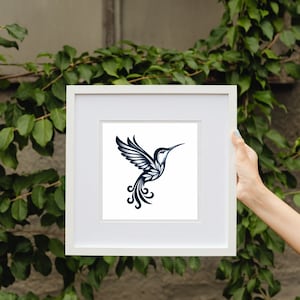 May include: A white frame with a black and white illustration of a hummingbird inside. The hummingbird is stylized with intricate details and a long, curved beak.