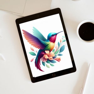 May include: A digital tablet displays a vibrant illustration of a hummingbird with colorful wings, a long beak, and a floral arrangement. The bird's feathers transition from blue to red, with green and orange accents. The tablet is on a white surface.