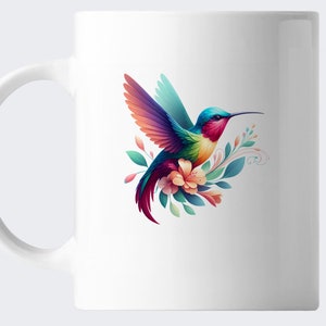 May include: White ceramic mug featuring a colorful hummingbird design. The hummingbird has vibrant blue, green, red, and yellow feathers, with a long beak and is surrounded by flowers and leaves. The mug has a curved handle.