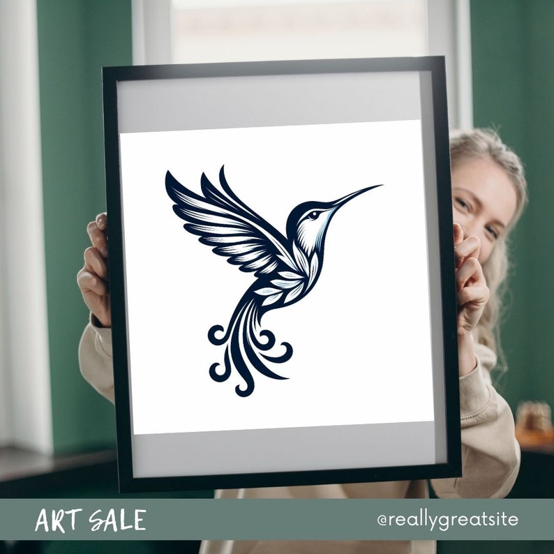 May include: A framed print of a stylized hummingbird with blue and white details. The hummingbird is flying with its wings spread and its tail feathers are curled. The background is white.