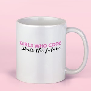 May include: White ceramic mug with a pink inscription that reads "Girls who code write the future".