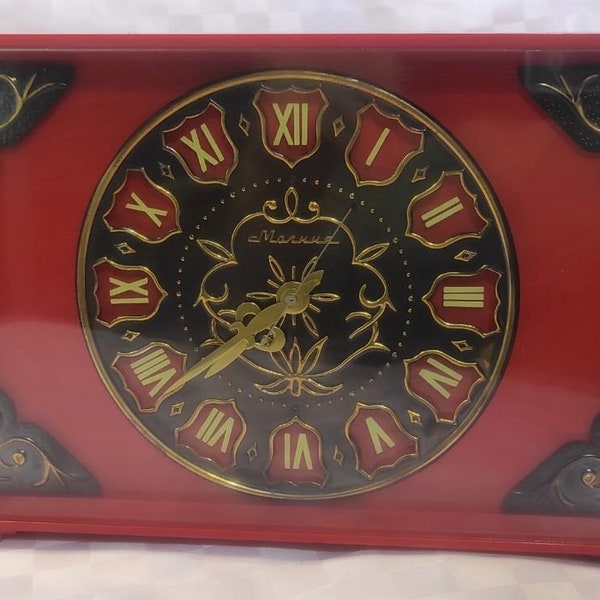 Soviet antique mechanical table clock Molniya, vintage Soviet retro, red, original.