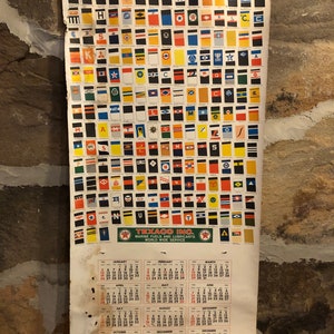 May include: A vintage Texaco calendar featuring a chart of ship stack insignia, a Texaco logo, and a 1942 calendar with months of January through December.