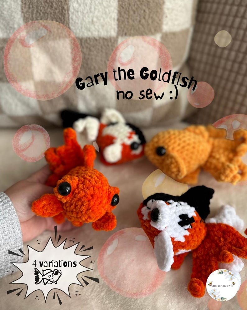 May include: Four crocheted goldfish toys in various colors: orange, black, white, and a combination. The text "Gary the Goldfish no sew :)" is visible. A sign says "4 variations".