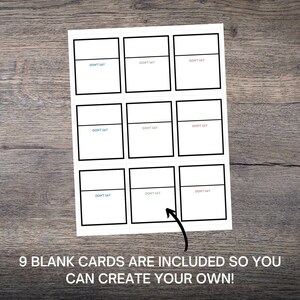 May include: A white card with nine blank boxes, each labeled "DON'T SAY". The text "9 BLANK CARDS ARE INCLUDED SO YOU CAN CREATE YOUR OWN!" is at the bottom. The card is on a wooden surface.