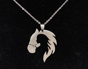 Horse and Girl sihouette Stainless Steel Horse Necklace with Cubic Zirconia. Gold plated or Silver Steel finish.