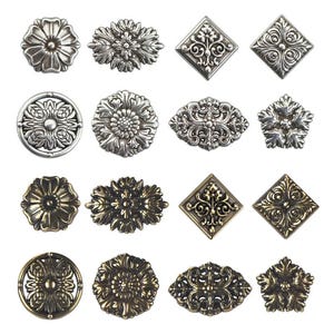 May include: Set of 12 silver and gold decorative metal embellishments with floral and geometric designs. The embellishments are ideal for adding a touch of elegance to any craft project.