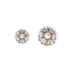 May include: A pair of silver flower-shaped earrings with a clear crystal in the centre of each flower.