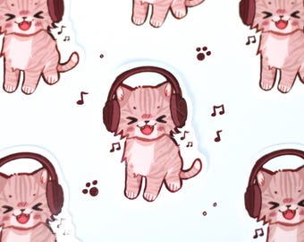 May include: A repeating pattern of stickers featuring a light pink tabby cat with dark pink stripes wearing large dark brown headphones. The cat has a joyful expression with eyes closed and mouth open, surrounded by small dark brown musical notes and paw prints.