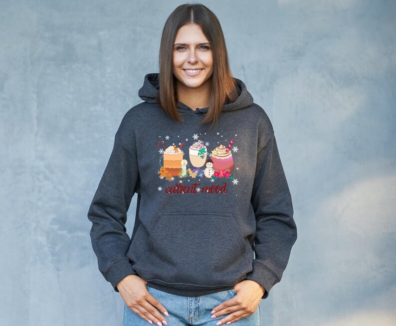 May include: A dark gray hoodie with a graphic of three winter drinks and the text "current mood".