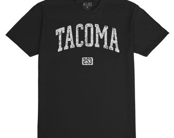 May include: Black t-shirt with a white distressed graphic that says "TACOMA" with the number "253" underneath. The shirt is made by Allies.
