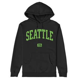 May include: Black hooded sweatshirt with a green distressed graphic that says "SEATTLE 206".