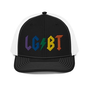 May include: A black and white trucker hat with a rainbow embroidered LGBT logo in a rock and roll style font.