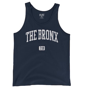 May include: Navy blue tank top with the text "THE BRONX" in distressed white lettering. Below the text is the number "718" in a white rectangle. The tank top has a classic, sleeveless design.