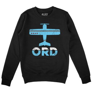 May include: Black sweatshirt featuring a blue and white airplane graphic with the text "ORD" in a distressed font. The airplane has red stars on its wings.