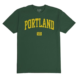 May include: A dark green t-shirt with a yellow vintage-style graphic that says "PORTLAND" with the number "503" underneath.