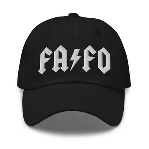 May include: Black baseball cap with a white embroidered design that says "FA/FO" in a rock and roll style font.