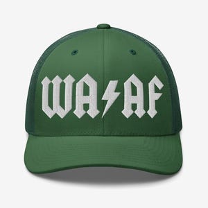 May include: A forest green trucker hat featuring a mesh back and a solid front panel. The front displays white embroidered text that reads WA AF with a lightning bolt symbol replacing the letter A in the center of the design.