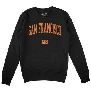 Op de afbeelding: Zwart sweatshirt met een oranje grafische print met de tekst "SAN FRANCISCO" met daaronder "415".