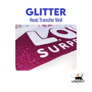 May include: Pink glitter heat transfer vinyl applied to a white t-shirt with the words "LOL SURPRISE" in white.