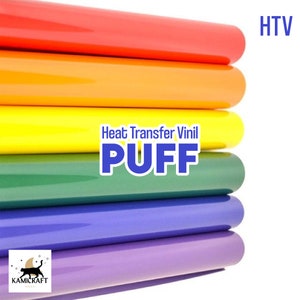 May include: A stack of six rolls of heat transfer vinyl in various colors, including red, orange, yellow, green, blue, and purple. The vinyl is labeled "Heat Transfer Vinyl PUFF" and "HTV".