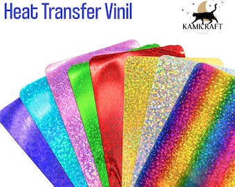 May include: Assortment of holographic heat transfer vinyl sheets in various colors, including blue, turquoise, light blue, pink, green, red, gold, silver, and rainbow.  The vinyl sheets are arranged in a fan shape.  The text "HOLOGRAPHIC Heat Transfer Vinyl" is at the top of the image.