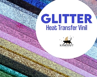 May include: A variety of glitter heat transfer vinyl in different colors, including gold, silver, pink, blue, green, and red. The vinyl is arranged in rows, with each row showing a different color. The text "GLITTER Heat Transfer Vinyl" is displayed in a white circle on top of the vinyl.