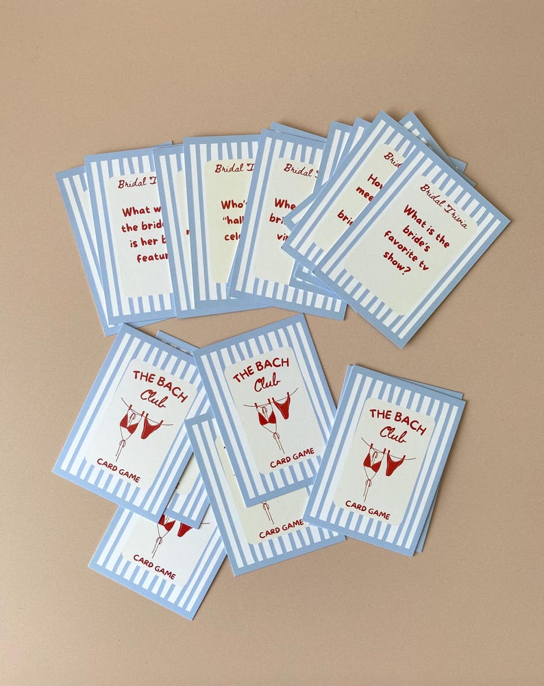 May include: A selection of blue and white striped cards. Some cards are labelled "Bridal Trivia" with questions. Others say "The Bach Club" with a graphic of red lingerie. The words "Card Game" are also visible on the cards.