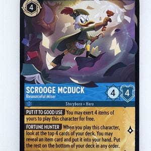 May include: Scrooge McDuck trading card from the Disney Lorcana trading card game. The card features a cartoon illustration of Scrooge McDuck holding a key and a stack of papers. The card text reads "Put it to good use: You may exert 4 items of yours to play this character for free. Fortune Hunter: When you play this character, look at the top 4 cards of your deck. You may reveal an item card and put it into your hand. Put the rest on the bottom of your deck in any order."