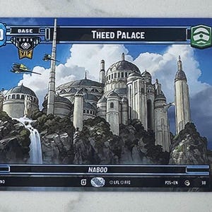 May include: A trading card featuring an illustration of Theed Palace on Naboo, with a waterfall and flying vehicles. The card has a blue and black border, with the number 30 and the text "Theed Palace" displayed.