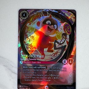 May include: A holographic trading card featuring Jack-Jack Parr from Disney's The Incredibles. The card has a colorful design with the number 4 in the top corners. Text includes "Incredible Potential" and "Weird Things Are Happening".