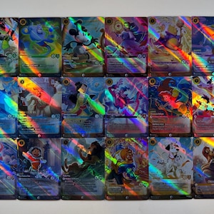 May include: A collection of holographic trading cards featuring various Disney characters. Each card displays a vibrant illustration with a rainbow prism effect. Characters include Mickey Mouse, Ariel, Jasmine, and others, with gold accents and character names.