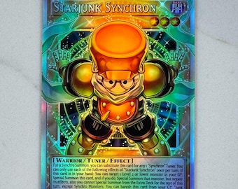 May include: A holographic trading card featuring the character "Starjunk Synchron." The card has a colorful design with a robot-like figure in orange and black. The card's text includes "WARRIOR / TUNER / EFFECT" and ATK/1300 DEF/500.