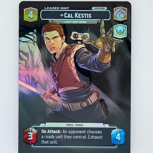 May include: A holographic trading card featuring Cal Kestis from the Star Wars franchise. The card has a black background with a portrait of a young man holding a lightsaber. The card includes text such as "Leader Unit" and "I Can't Keep Hiding."