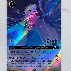 May include: A holographic Disney Lorcana trading card featuring Elsa, Ice Maker, with a blue and purple color palette. The card displays the character, the name Elsa, the text Winter Wall, and game statistics including a cost of 7 and 5/5 power.