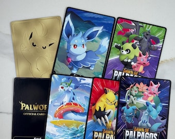May include: A collection of seven rectangular trading cards featuring colorful illustrations of various creatures. One card is gold with an etched design, while others display characters, the text Dawn of Palpagos, and the word Soul at the bottom.