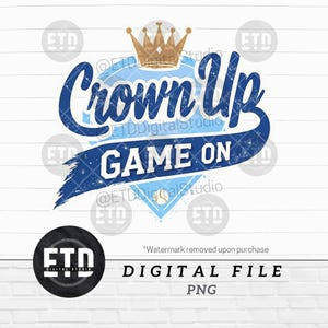 May include: A digital design featuring the text "Crown Up" in a distressed blue font, with a gold crown above. Below, "Game On" is displayed on a blue banner. A baseball graphic is at the bottom. The words "Digital File" and "PNG" are also included.