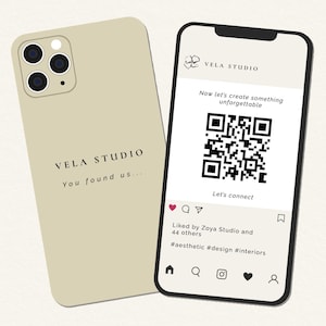 May include: A beige phone case and a smartphone showing a social media post. The phone case has the text "VELA STUDIO" and "You found us...". The smartphone displays a QR code and the text "Now let's create something unforgettable."