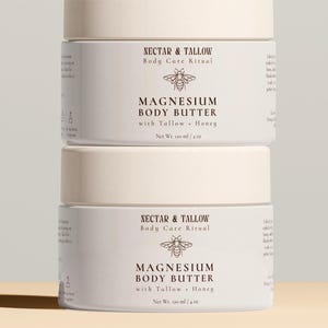 May include: Stacked white jars of Magnesium Body Butter with the text "Nectar & Tallow Body Care Ritual" and "Magnesium Body Butter with Tallow + Honey". Each jar is 4 oz.